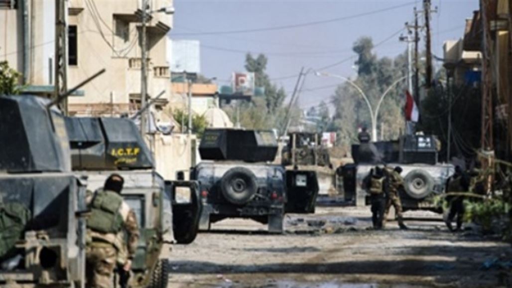 Edit Technical Institute at the University of Mosul building and raising the Iraqi flag over it