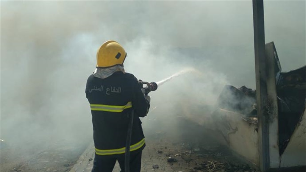 اندلاع حريق داخل بناية تجارية في بغداد